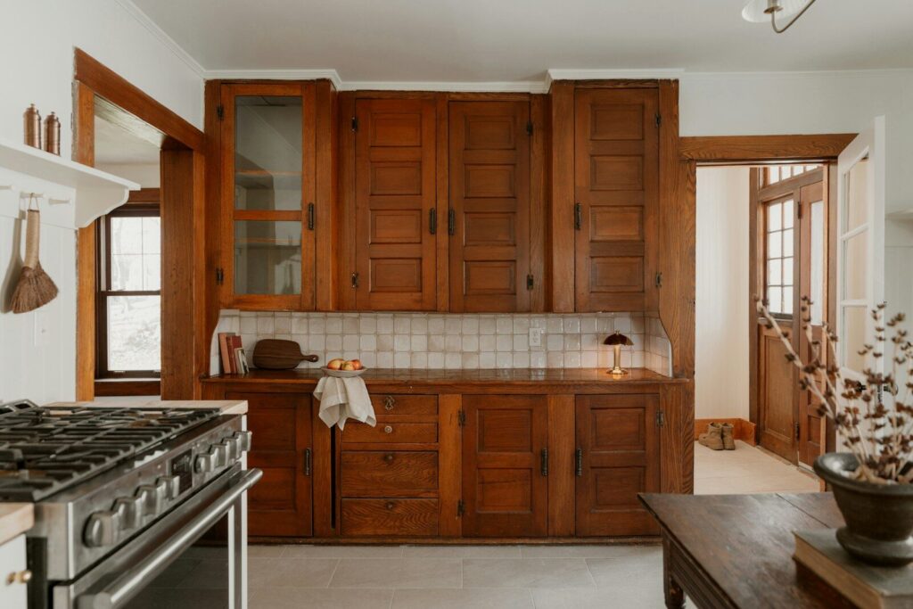 Vintage wooden kitchen cabinets with tiled backsplash